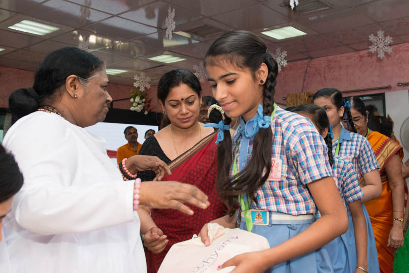 Amma distributing Saukhyam pads during International Women' s Day